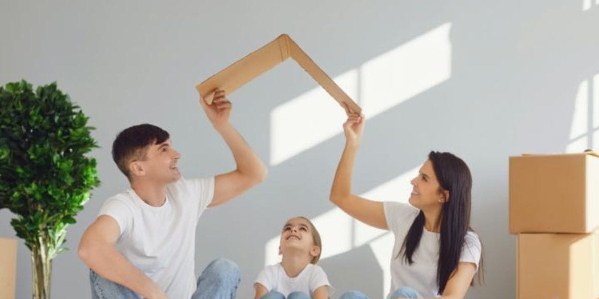 A young couple and their child setting up a new home